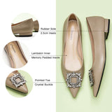 Sophisticated camel leather flats with tasteful adornments.