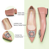 Sophisticated pink leather flats with tasteful adornments."