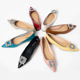 Elevate your style with red embellished leather flats.