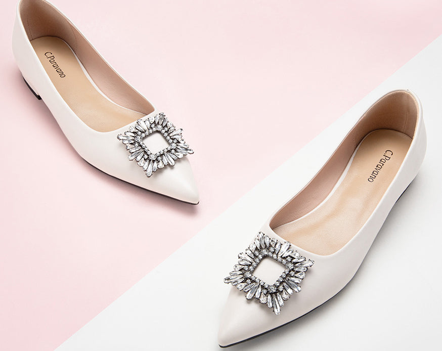 Chic and stylish white embellished leather flats to enhance your look.