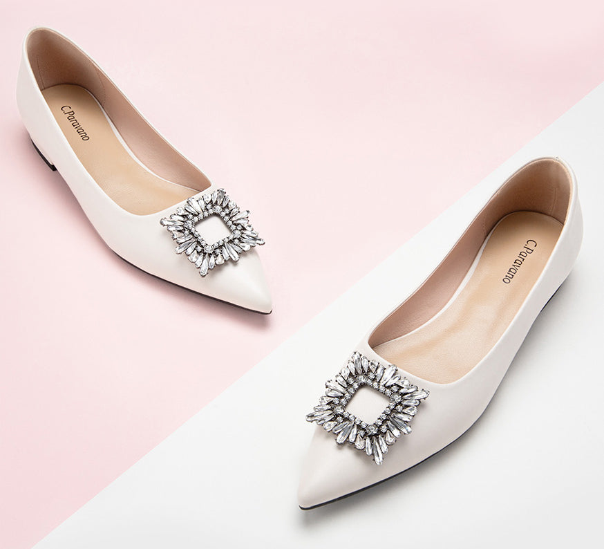 Chic and stylish white embellished leather flats to enhance your look.
