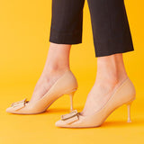 Fashionable-beige-pumps-featuring-stylish-buckles_-providing-a-trendy-and-eye-catching-design