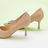 Fashionable-beige-pumps-in-leather-with-eye-catching-embellishments_-providing-a-trendy-and-unique-design