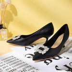 Fashionable-black-leather-pumps-featuring-eye-catching-embellishments_-providing-a-trendy-and-unique-design