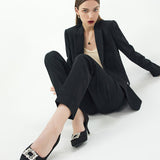 Fashionable-black-pumps-in-tweed-with-eye-catching-embellishments_-providing-a-trendy-and-unique-design