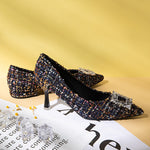 Fashionable-navy-blue-pumps-in-tweed-with-eye-catching-embellishments_-providing-a-trendy-and-unique-design