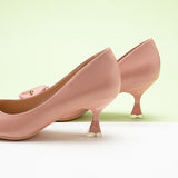 Fashionable-pink-pumps-featuring-stylish-C-shaped-buckles_-providing-a-trendy-and-eye-catching-design