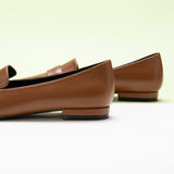 Penny Strap Loafers in Brown, providing a cozy and stylish addition to your footwear collection