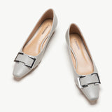 Pair of grey low heels closed toe shoes