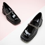 Black Platform Loafers with metal accents, adding a stylish and contemporary touch to your ensemble