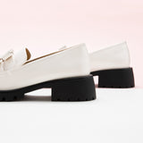 White Double Knot Loafers with a platform sole, providing a sleek and sophisticated look