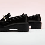 Black Pearl Platform Loafers, perfect for a confident and fashionable look in any urban setting.