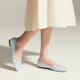 Ocean Blue Elegance: Patent Crossed Stripe Mary Jane shoes in a serene blue hue, a stylish and vibrant choice for a touch of the sea