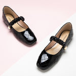 Black Patent Mary Jane with Crossed Stripes, perfect for adding a touch of city glamour to your ensemble