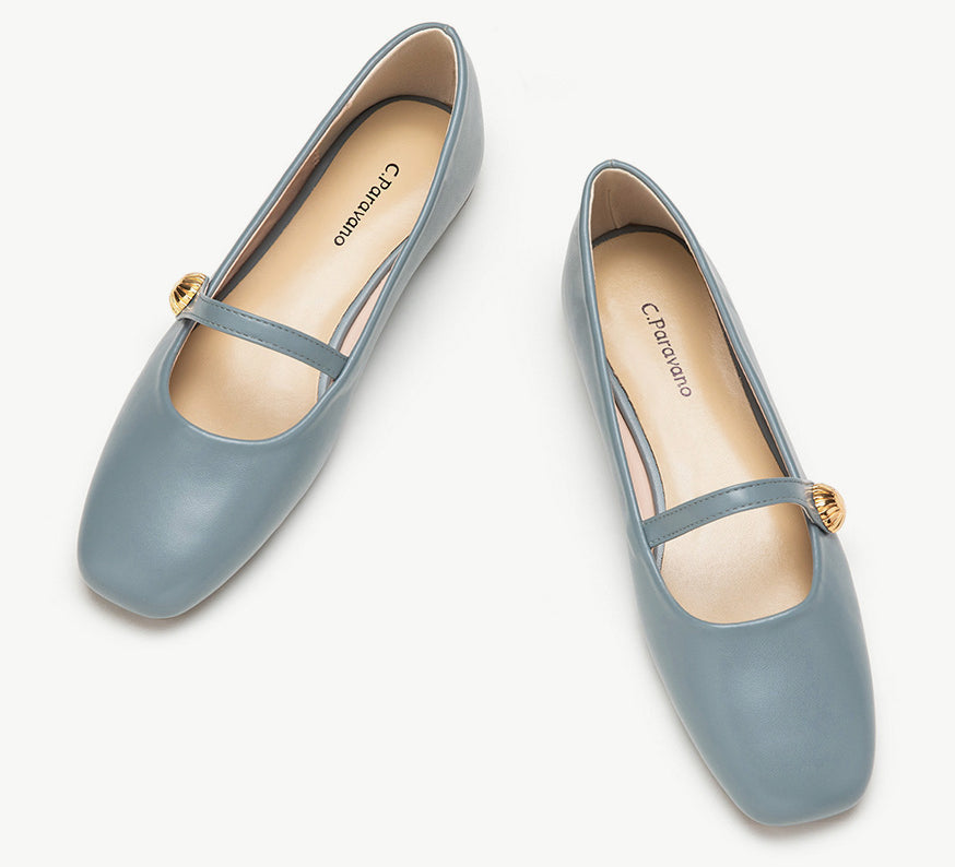 Blue Mary Jane shoes with a single stripe and button detail