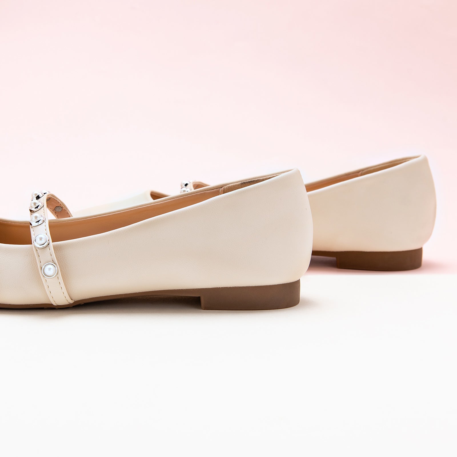 White Mary Jane Flats with a single stripe and pearl, a chic and minimalist option for elevating your everyday style.