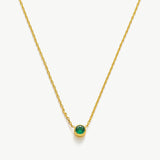 Gold Emerald Crystal Pendant Necklace, showcasing a vibrant emerald green crystal pendant on a delicate gold chain, adding a touch of elegance to your style.