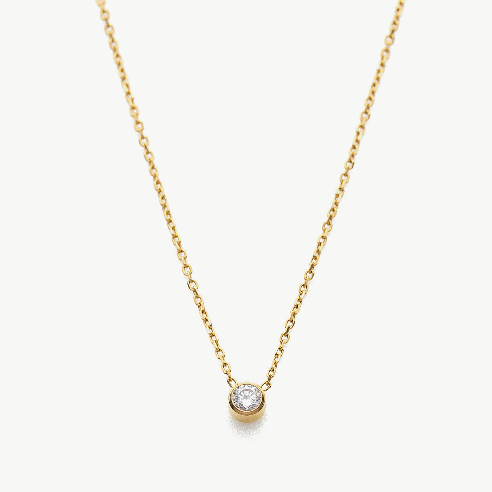  Crystal Pendant Necklace in Gold, showcasing a timeless gold pendant that adds a touch of elegance and sophistication to your neckline