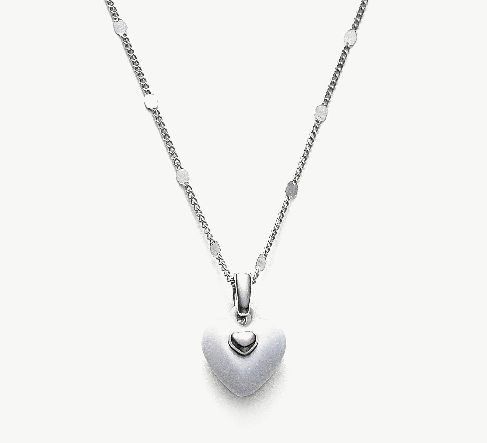 Onyx Heart Pendant Necklace, a timeless piece featuring a heart-shaped onyx pendant in pure white, adding a touch of elegance and sophistication to your neckline.