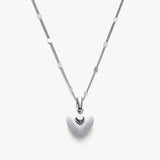 Onyx Heart Pendant Necklace, a timeless piece featuring a heart-shaped onyx pendant in pure white, adding a touch of elegance and sophistication to your neckline.