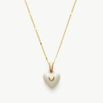 Onyx Heart Pendant Necklace in White, symbolizing opulent white beauty, this necklace features a captivating heart-shaped onyx pendant suspended from a delicate chain.