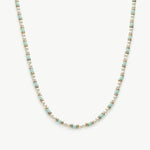 Pearl Beaded Necklace, a classic piece featuring a strand of lustrous pearls delicately strung together, adding a touch of timeless elegance to your neckline