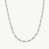 Pearl Beaded Necklace, a classic piece featuring a strand of lustrous pearls delicately strung together, adding a touch of timeless elegance to your neckline