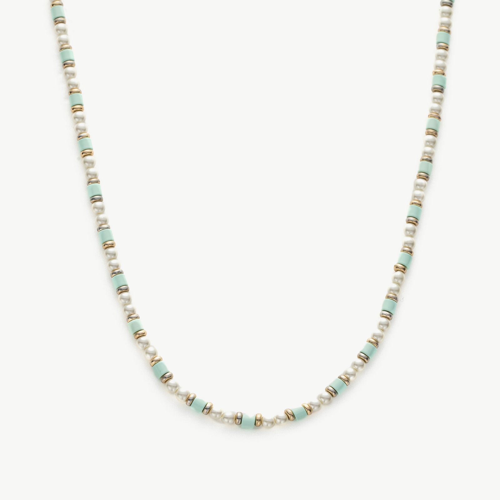 Pearl Beaded Necklace, a classic piece featuring a strand of lustrous pearls delicately strung together, adding a touch of timeless elegance to your neckline