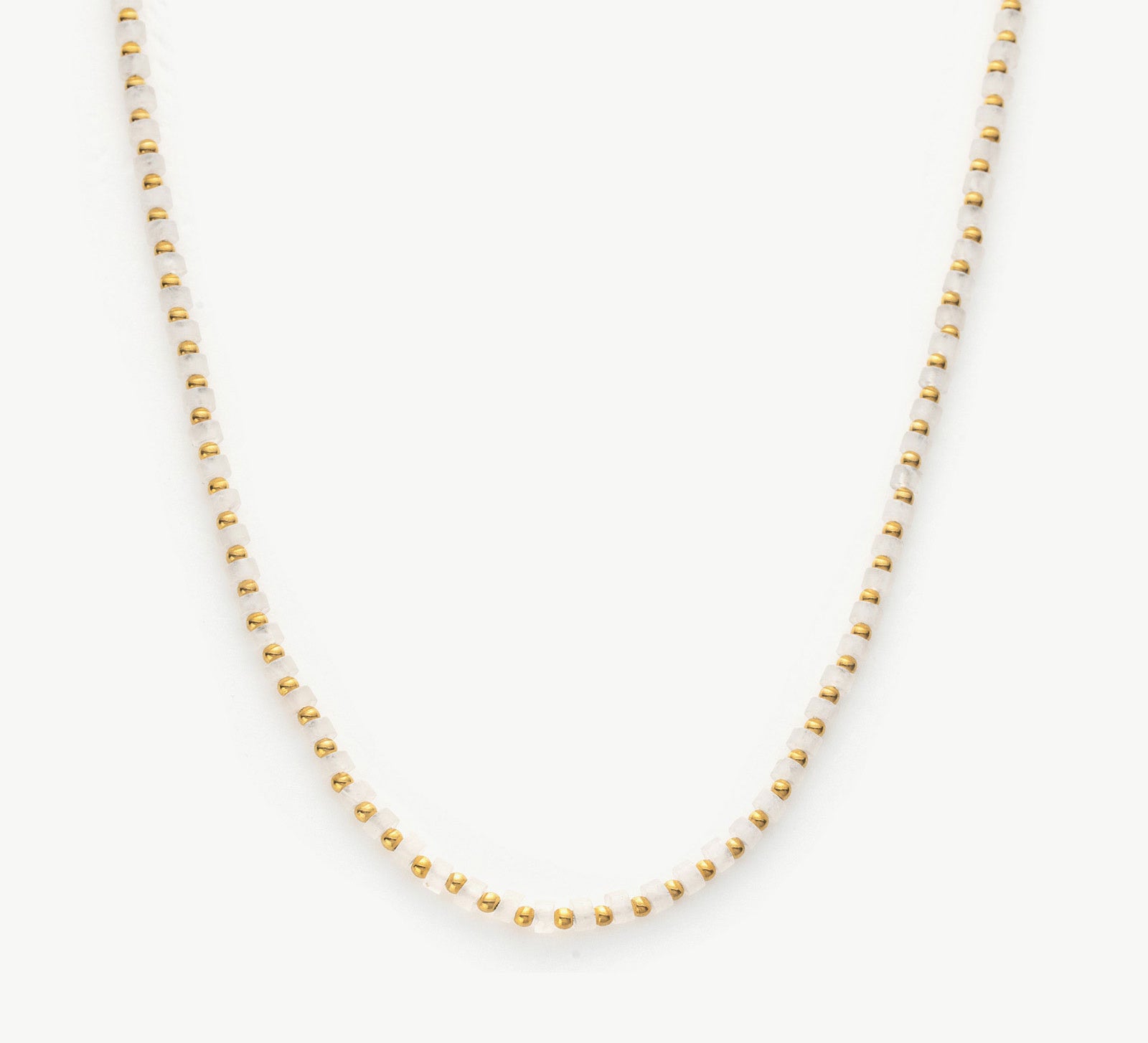 Gold Stone Beaded Necklace, a timeless piece featuring a strand of lustrous beads in golden hues, creating an opulent and elegant accessory for a touch of sophistication