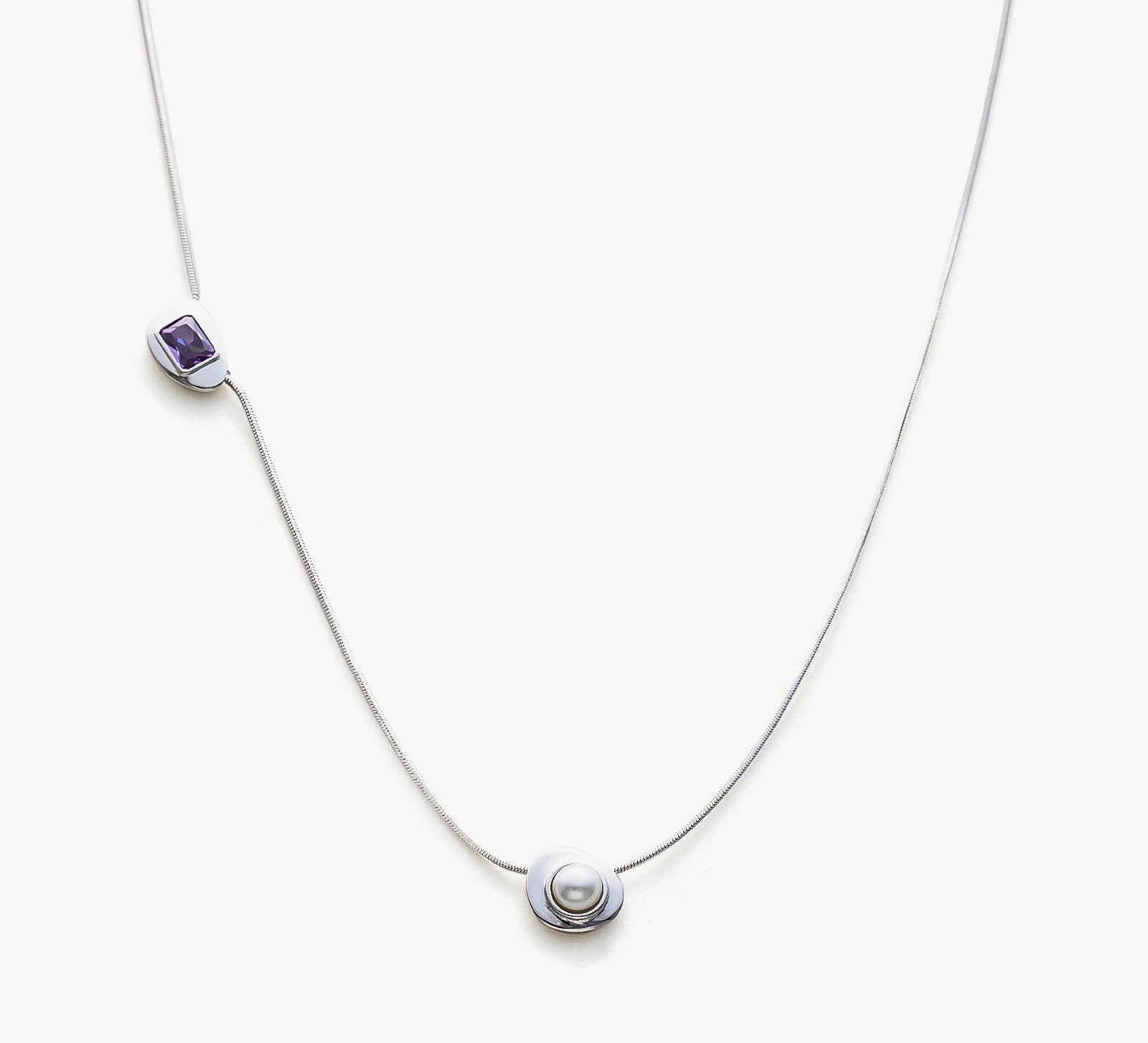Platinum Crystal Drop Necklace with a captivating sapphire crystal pendant, showcasing a sophisticated and radiant design on a platinum chain, adding a touch of glamour and sophistication to your ensemble.