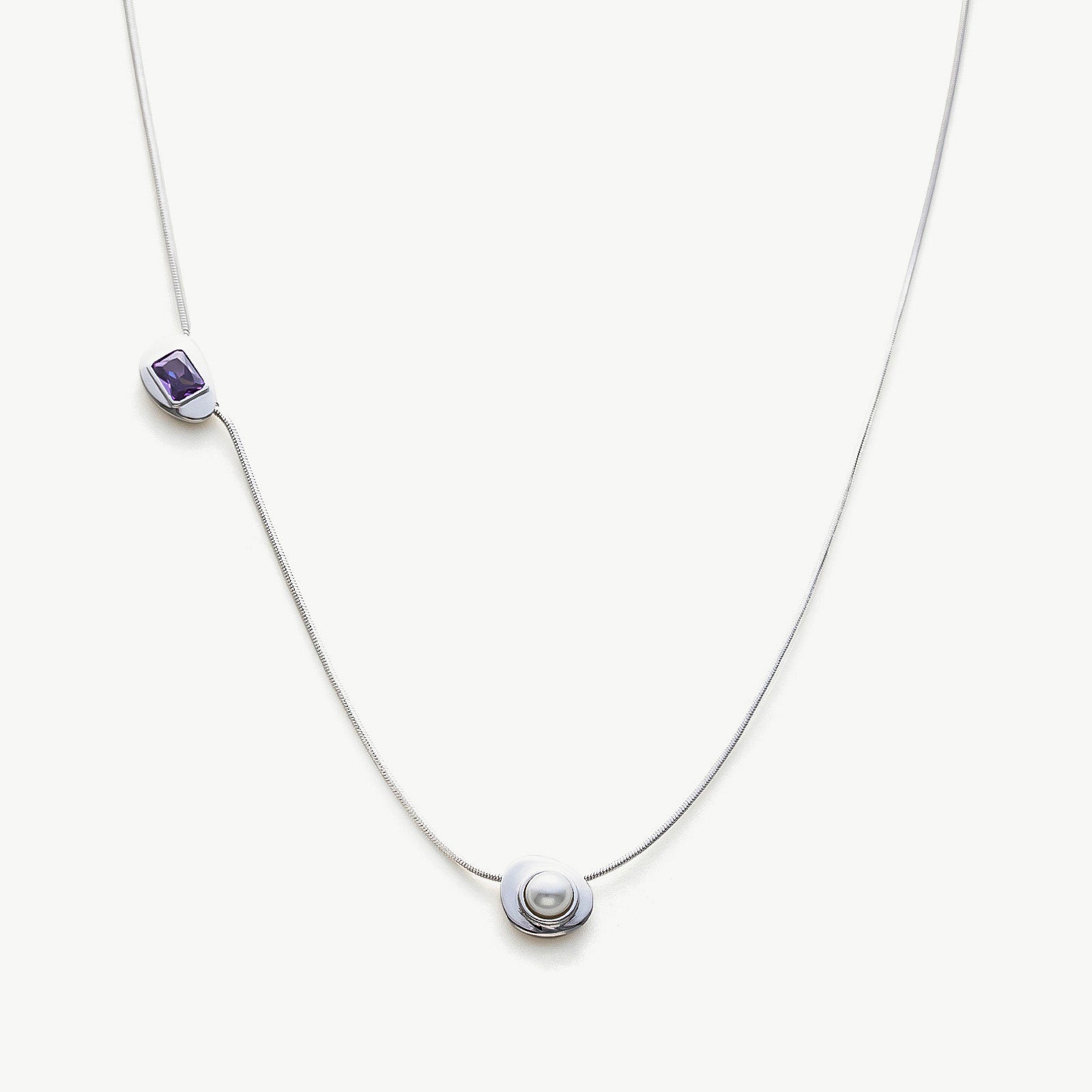 Platinum Crystal Drop Necklace with a captivating sapphire crystal pendant, showcasing a sophisticated and radiant design on a platinum chain, adding a touch of glamour and sophistication to your ensemble.