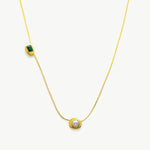 Gold Crystal Drop Necklace with a captivating emerald crystal pendant, showcasing an elegant and radiant design on a golden chain, adding a touch of glamour and sophistication to your ensemble.