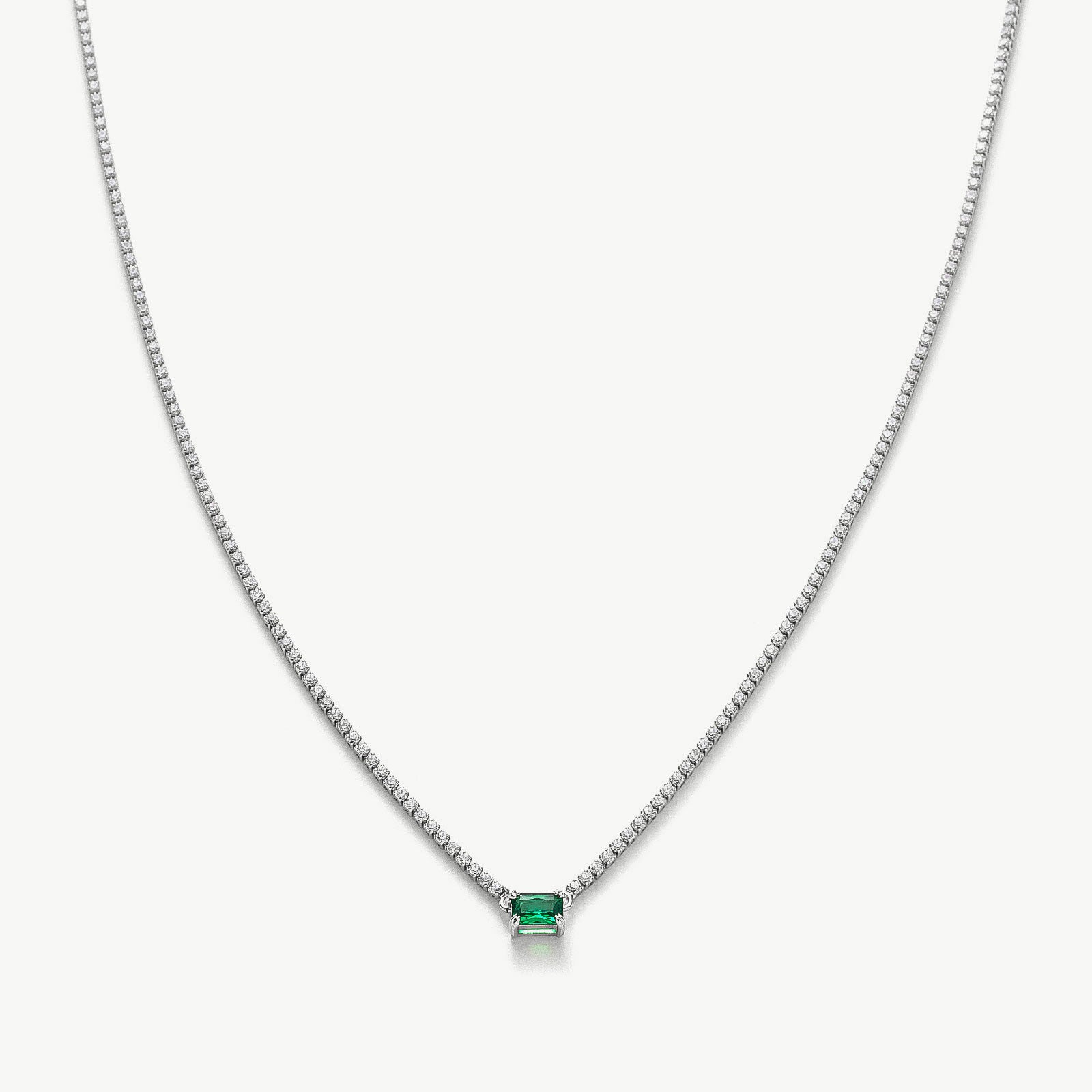 Emerald Rectangle Dewdrop Pendant, a regal and elegant accessory featuring a captivating emerald rectangle dewdrop pendant, adding a touch of sophistication and allure to your neckline
