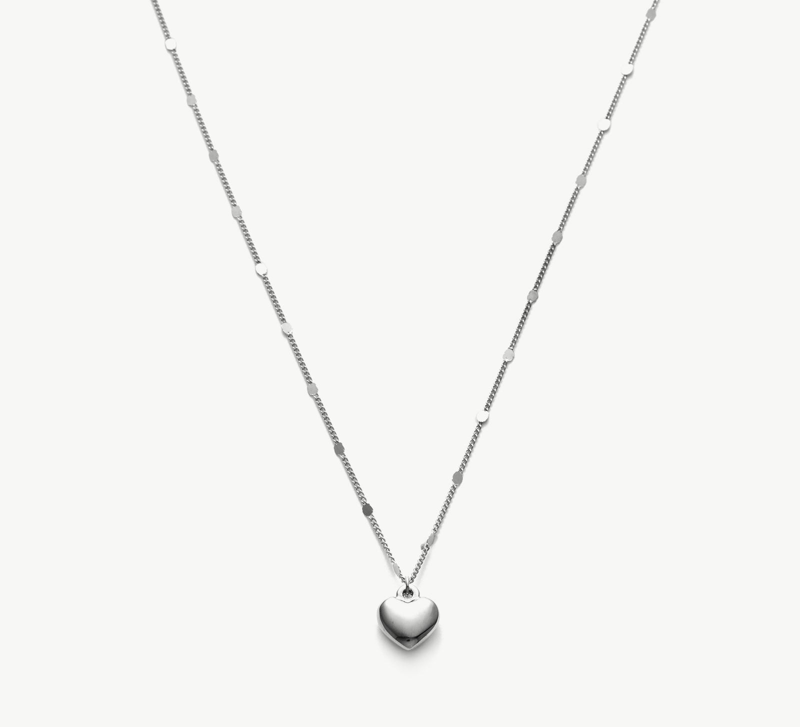 Platinum Heart Pendant Necklace, a chic platinum accent that enhances your style, featuring a stylish heart-shaped pendant in a lustrous platinum hue