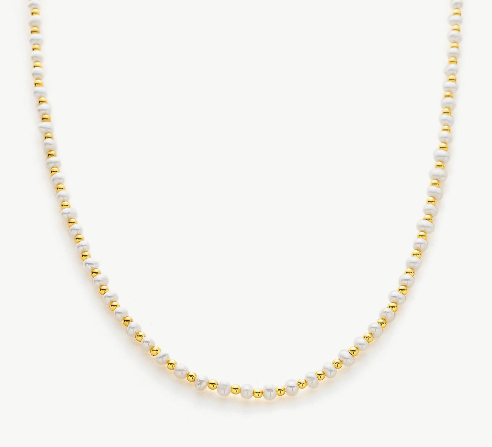 Gold Pearl Beaded Necklace, a chic combination of pearls and gold, creating a stylish and versatile accessory that enhances your ensemble with timeless sophistication
