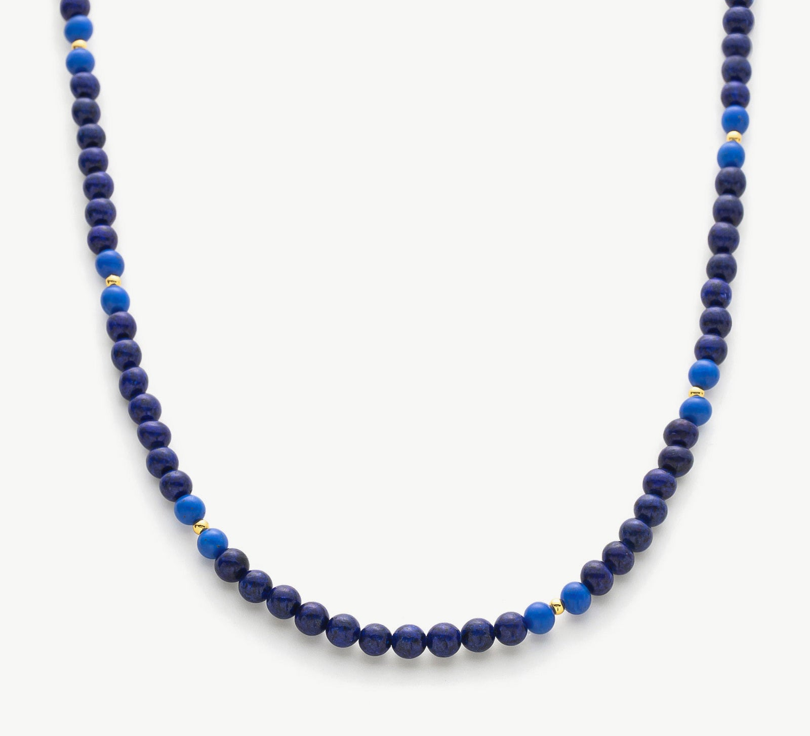 Lapis Blue Necklace, a captivating piece inspired by the deep blue hues of the ocean, featuring a lapis lazuli pendant suspended from a delicate chain for a touch of maritime elegance