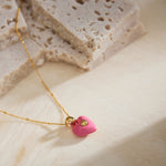  Onyx Heart Pendant Necklace in Pink, radiating eternal pink radiance, this necklace features a captivating heart-shaped onyx pendant suspended from a delicate chain, expressing enduring style and grace.