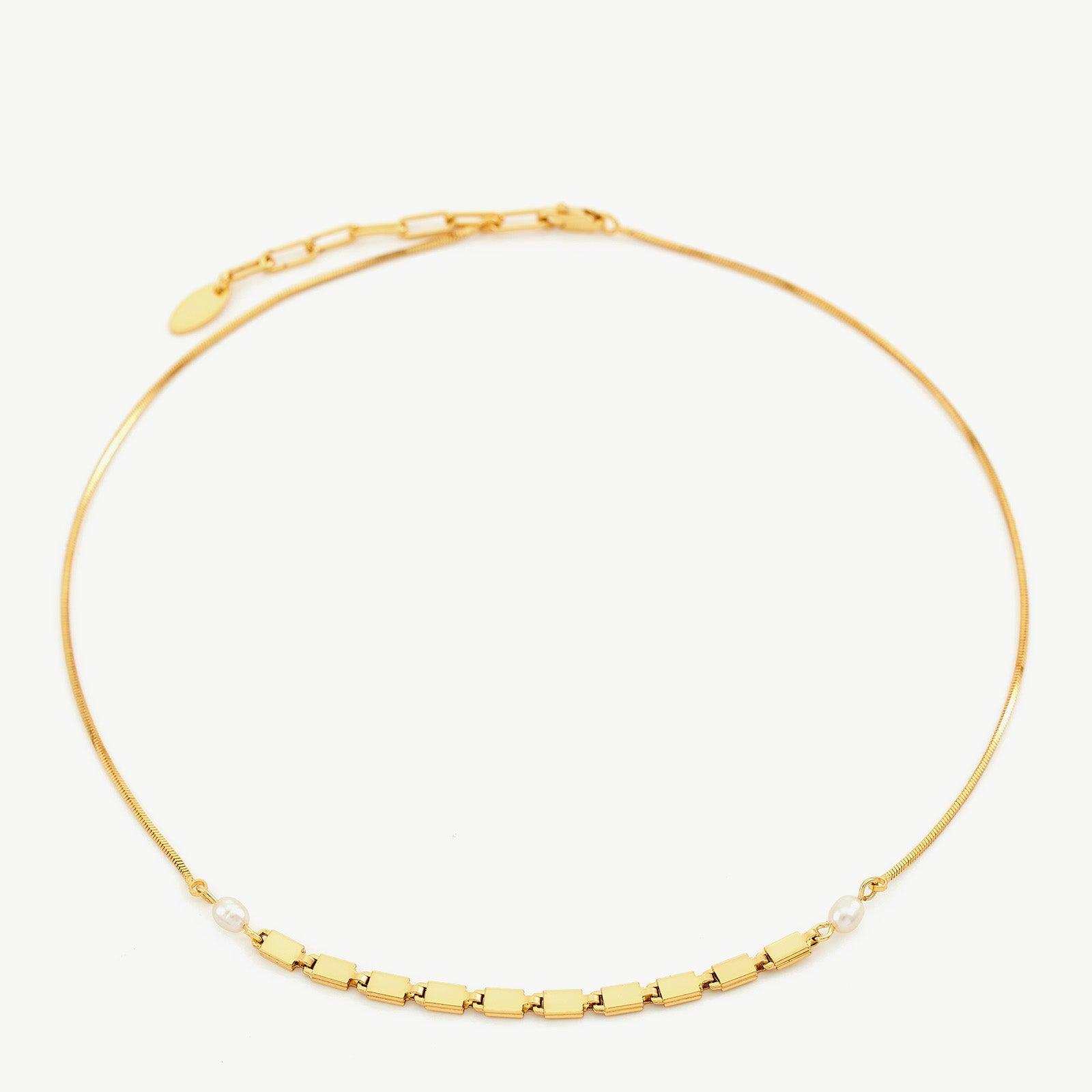  Pearl Chain Necklace, a radiant pearl charm captured in a delicate chain, creating a stylish and timeless accessory to elevate your ensemble