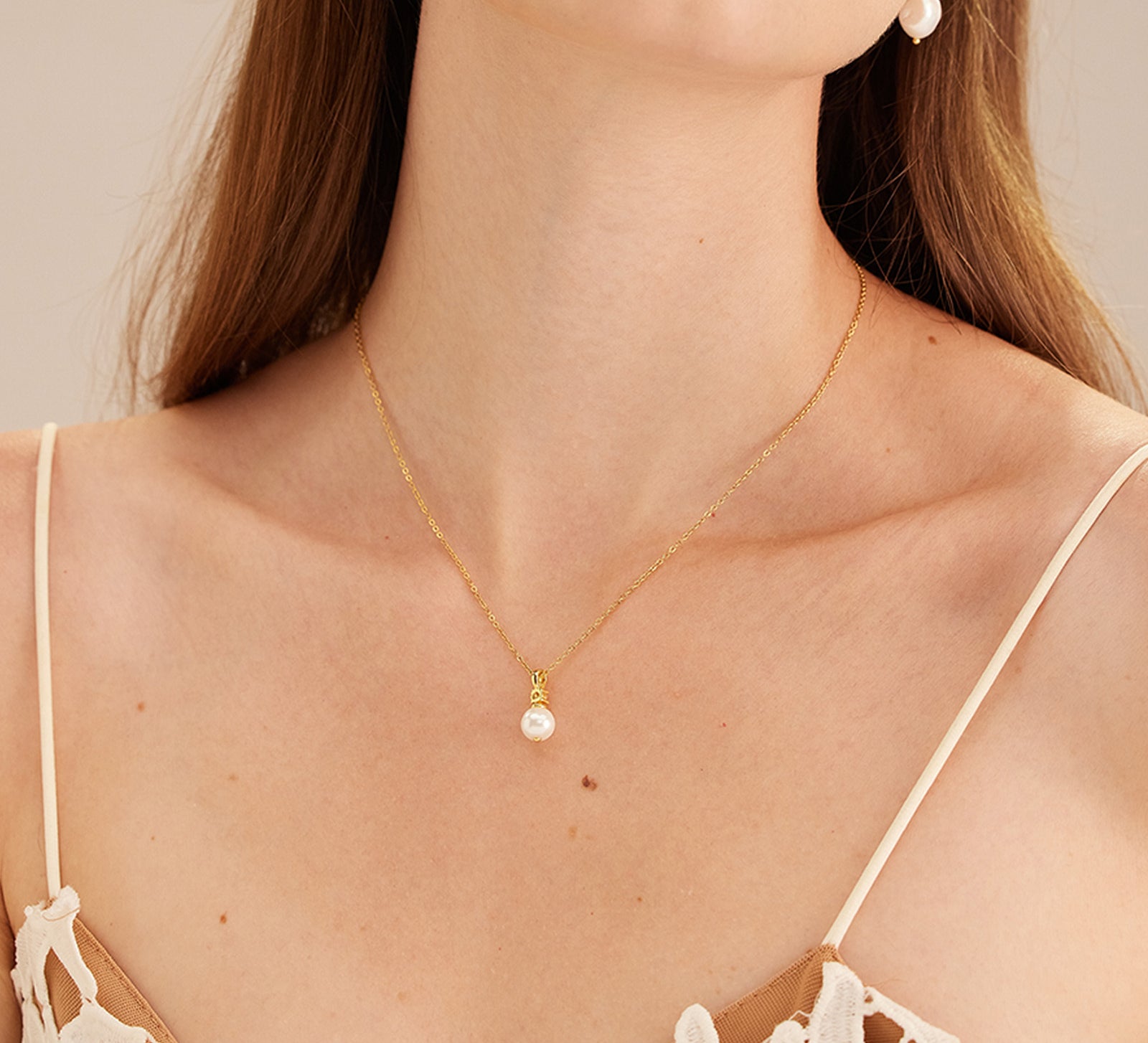 Gold Pearl Drop Pendant Necklace, a chic gold accent that enhances your style, featuring a stylish pearl drop pendant in a radiant gold hue