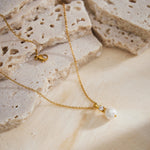 Pearl Drop Pendant Necklace in Gold, symbolizing opulent gold beauty, this necklace features a captivating pearl drop pendant suspended from a delicate gold chain