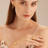 Crystal Pendant Necklace in Gold, symbolizing opulent gold beauty, this necklace features a captivating crystal pendant suspended from a delicate gold chain