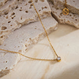 Gold Crystal Pendant Necklace, exuding luxurious gold sparkle, this necklace features a dazzling crystal pendant in a shimmering gold shade