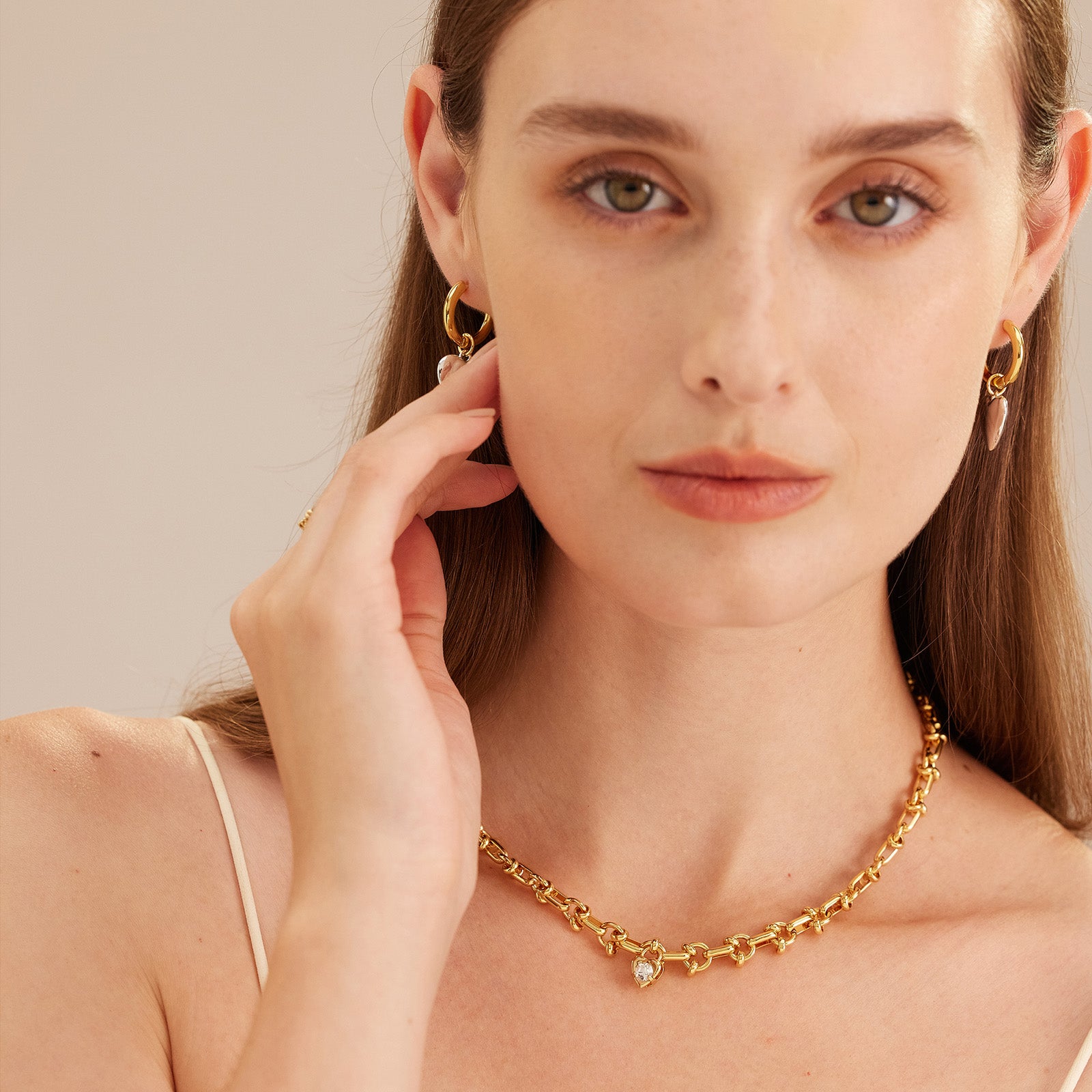 Gold Heart Diamond Necklace, exuding golden elegance, this necklace showcases intricately designed heart motifs adorned with diamonds, adding a touch of glamour and sophistication to your neckline