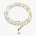 Long Pearl Necklace, a timeless and simple design showcasing a strand of pearls with a length that exudes sophistication, making it a versatile piece for various occasions.