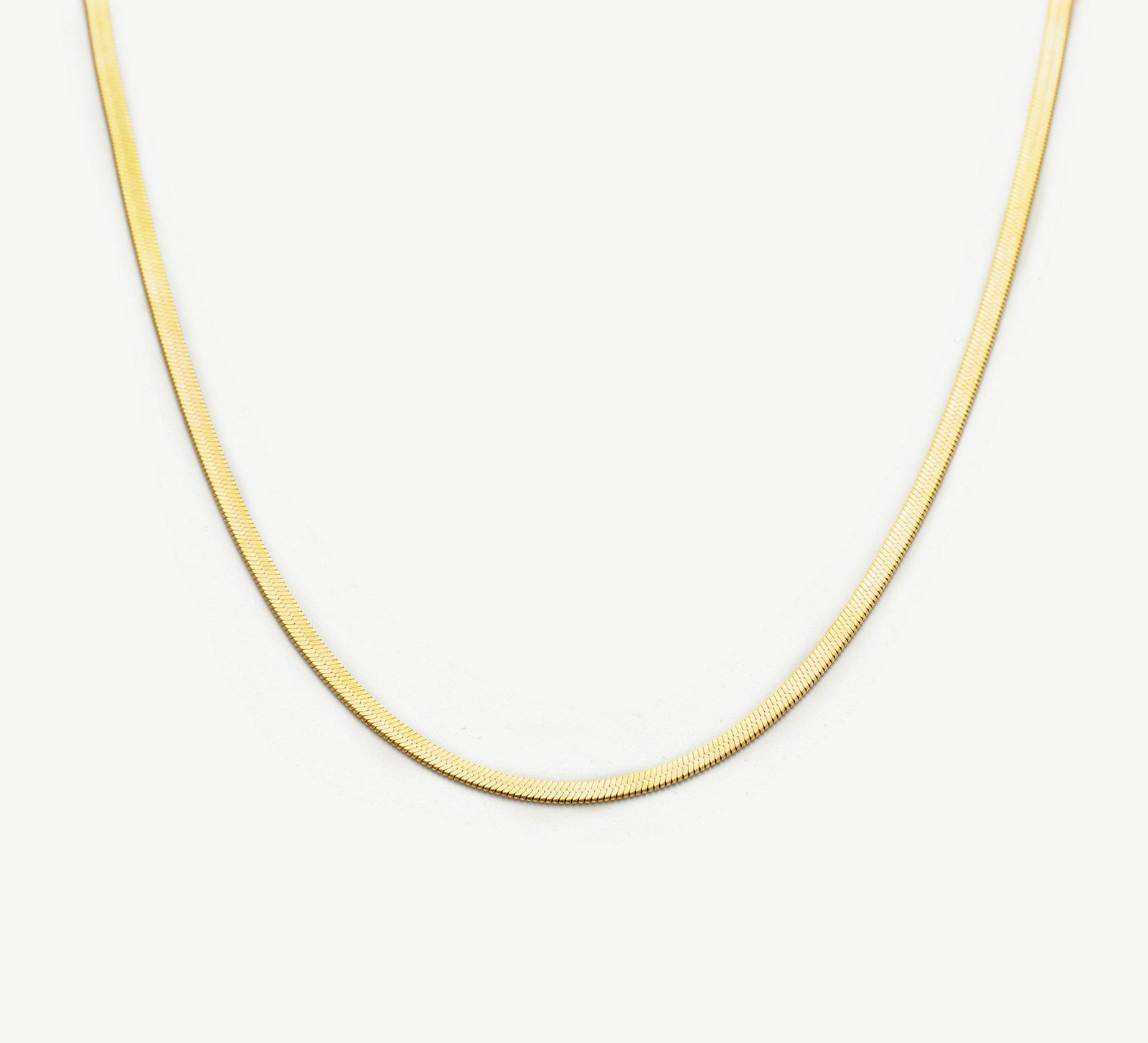 Snake Chain Necklace, a sleek and modern piece featuring a serpent-like chain that effortlessly wraps around your neckline, adding a touch of contemporary elegance to your look