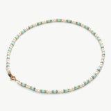 Pearl Beaded Necklace, symbolizing opulent pearl beauty, this necklace showcases a captivating strand of pearls, creating a sophisticated and versatile accessory.