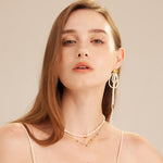 Gold Pearl Pendant Choker, exuding golden luminescence, this choker showcases a radiant gold chain adorned with a single pearl pendant, adding a touch of glamour and grace to your neckline