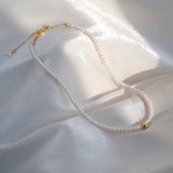  Pearl Gold Choker Necklace, embodying pearlescent romance, this choker showcases a single pearl pendant on a gold chain, creating a stunning and romantic accessory for expressing love and style.