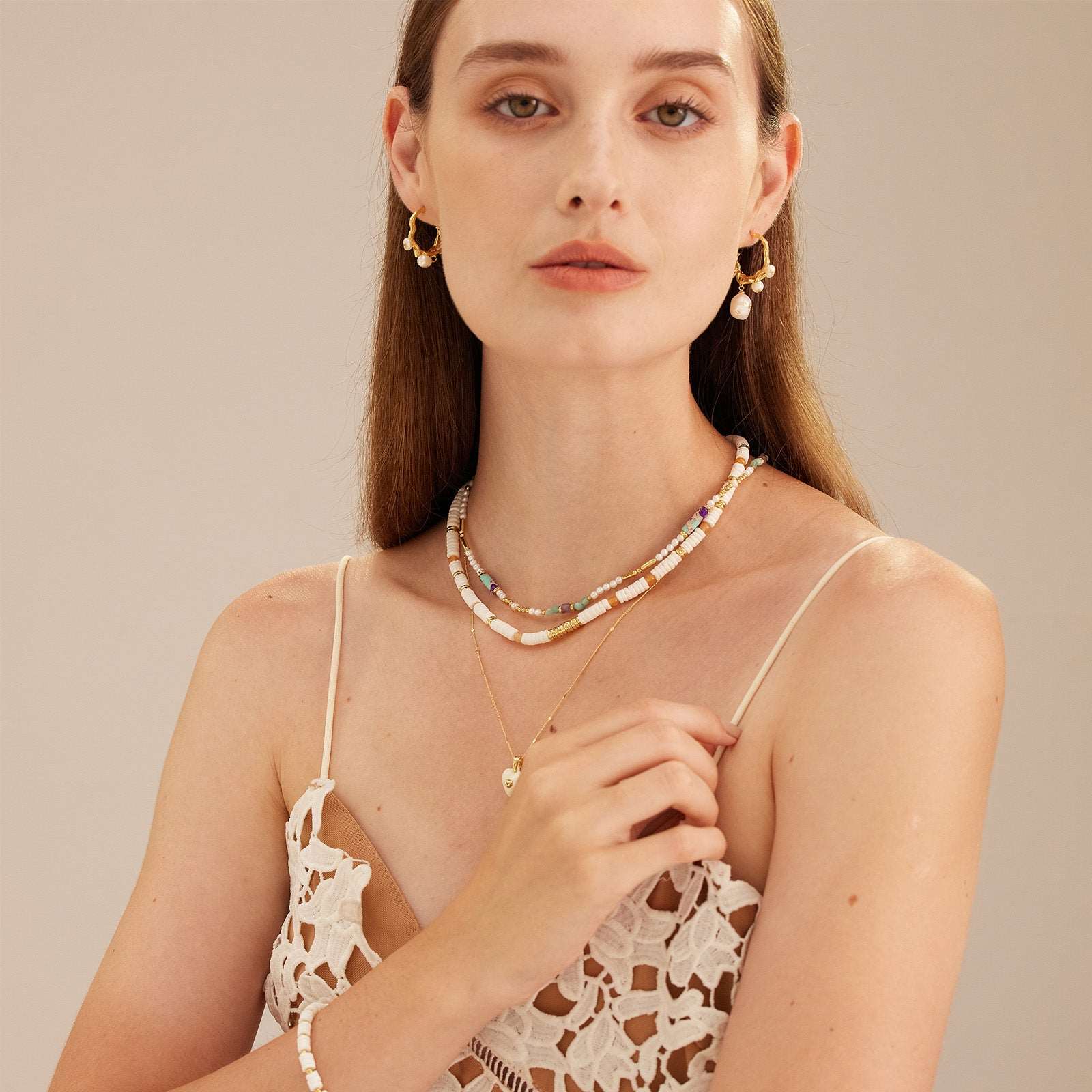  Beaded Stack Necklace, a versatile ensemble of beads stacked together in harmonious colors, allowing you to effortlessly mix and match with various outfits for a trendy and stylish look.