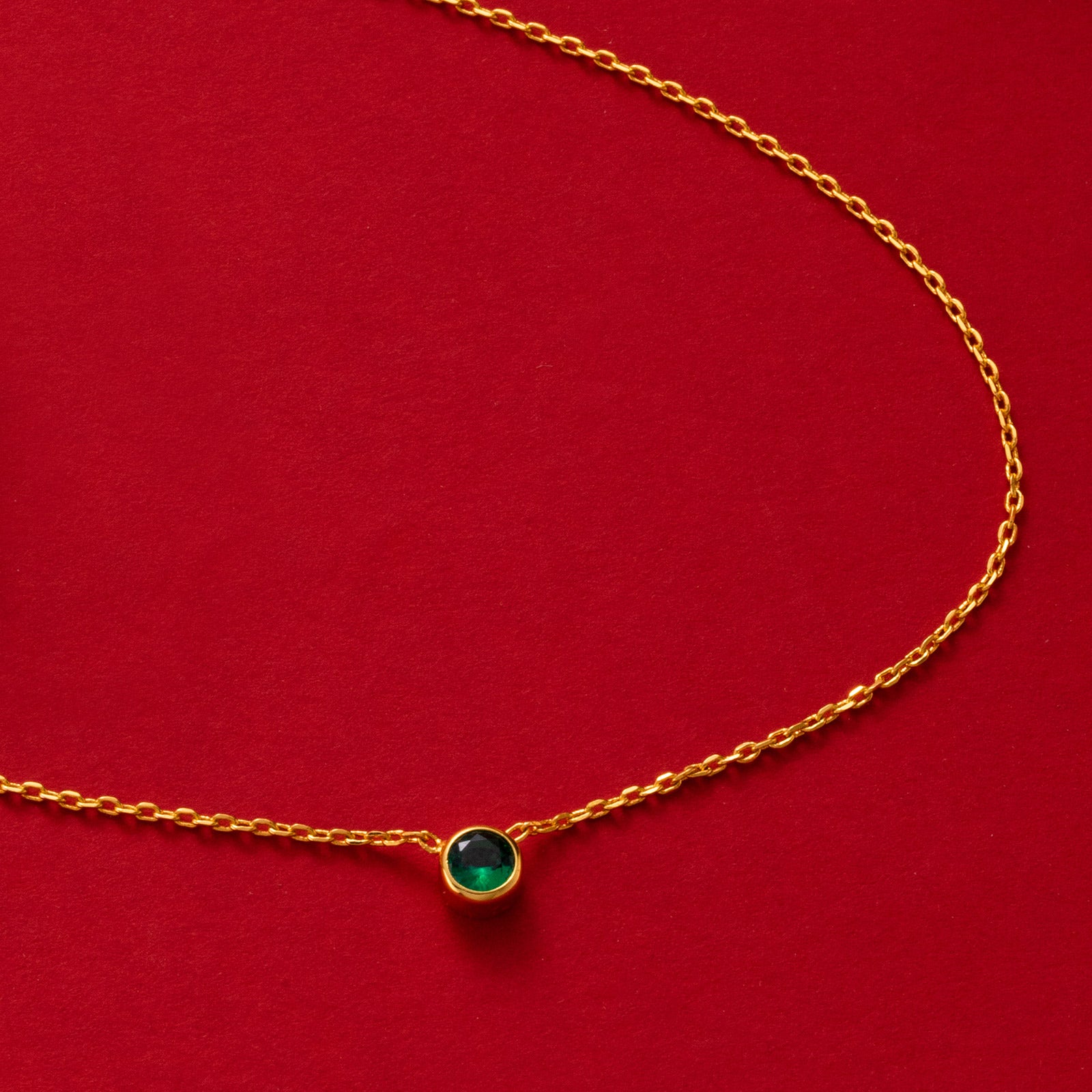 Gold Emerald Crystal Pendant Necklace, symbolizing timeless emerald sparkle, this necklace features a dazzling crystal pendant in a radiant green shade